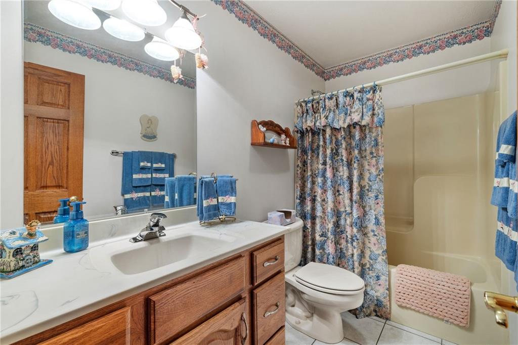 3746 Matthews Road Edinburg, PA 16116 - Photo 31 of 36 a bathroom with a sink toilet and shower