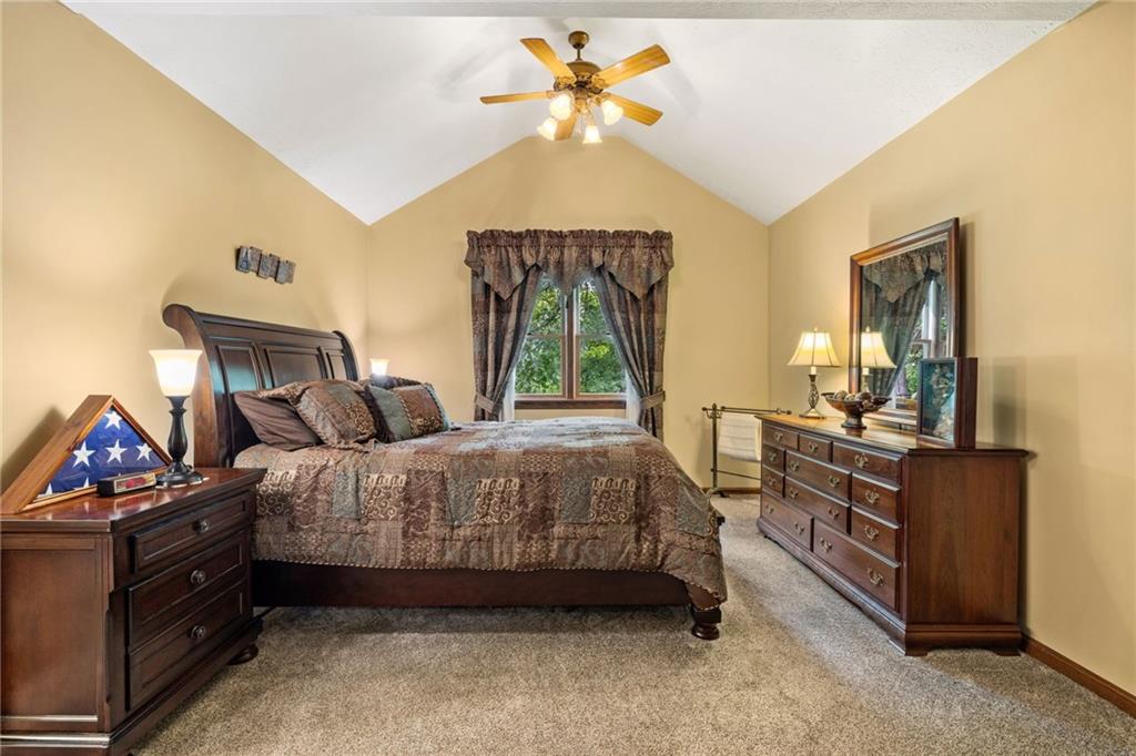 3746 Matthews Road Edinburg, PA 16116 - Photo 35 of 36 a bedroom with a bed and a chandelier