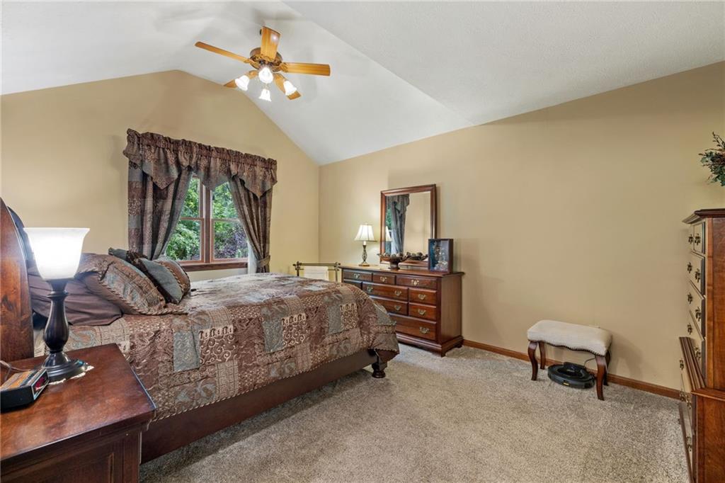 3746 Matthews Road Edinburg, PA 16116 - Photo 36 of 36 a bedroom with a bed and a chandelier