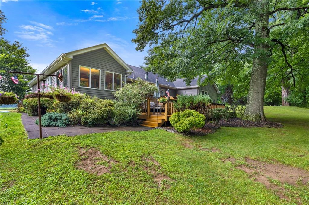 3746 Matthews Road Edinburg, PA 16116 - Photo 8 of 36 a front view of a house with garden