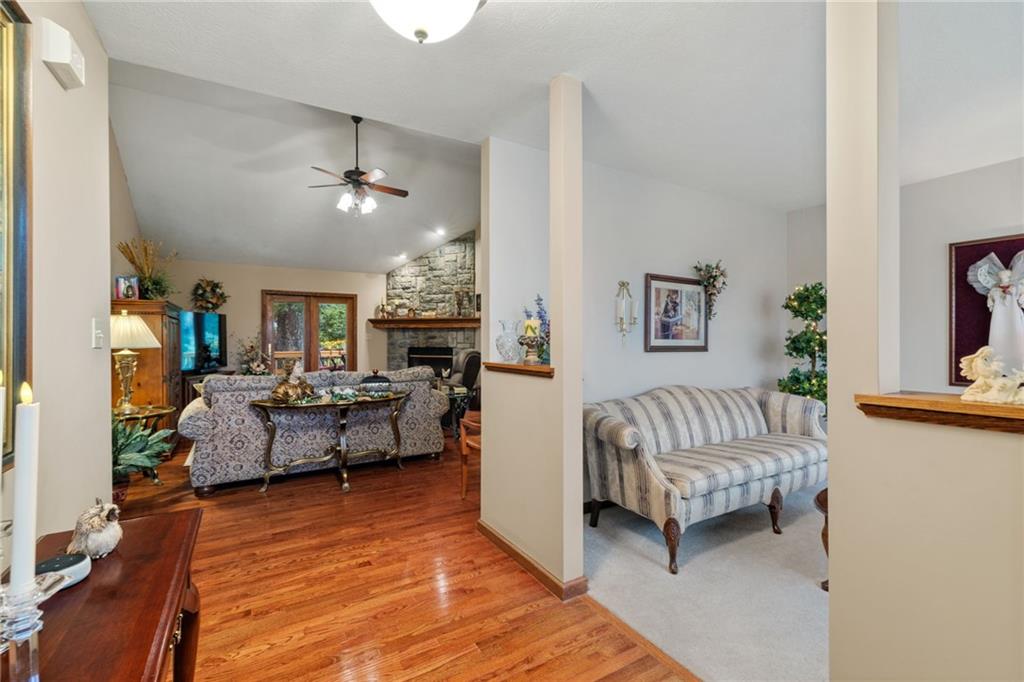 3746 Matthews Road Edinburg, PA 16116 - Photo 10 of 36 a living room with furniture and a chandelier
