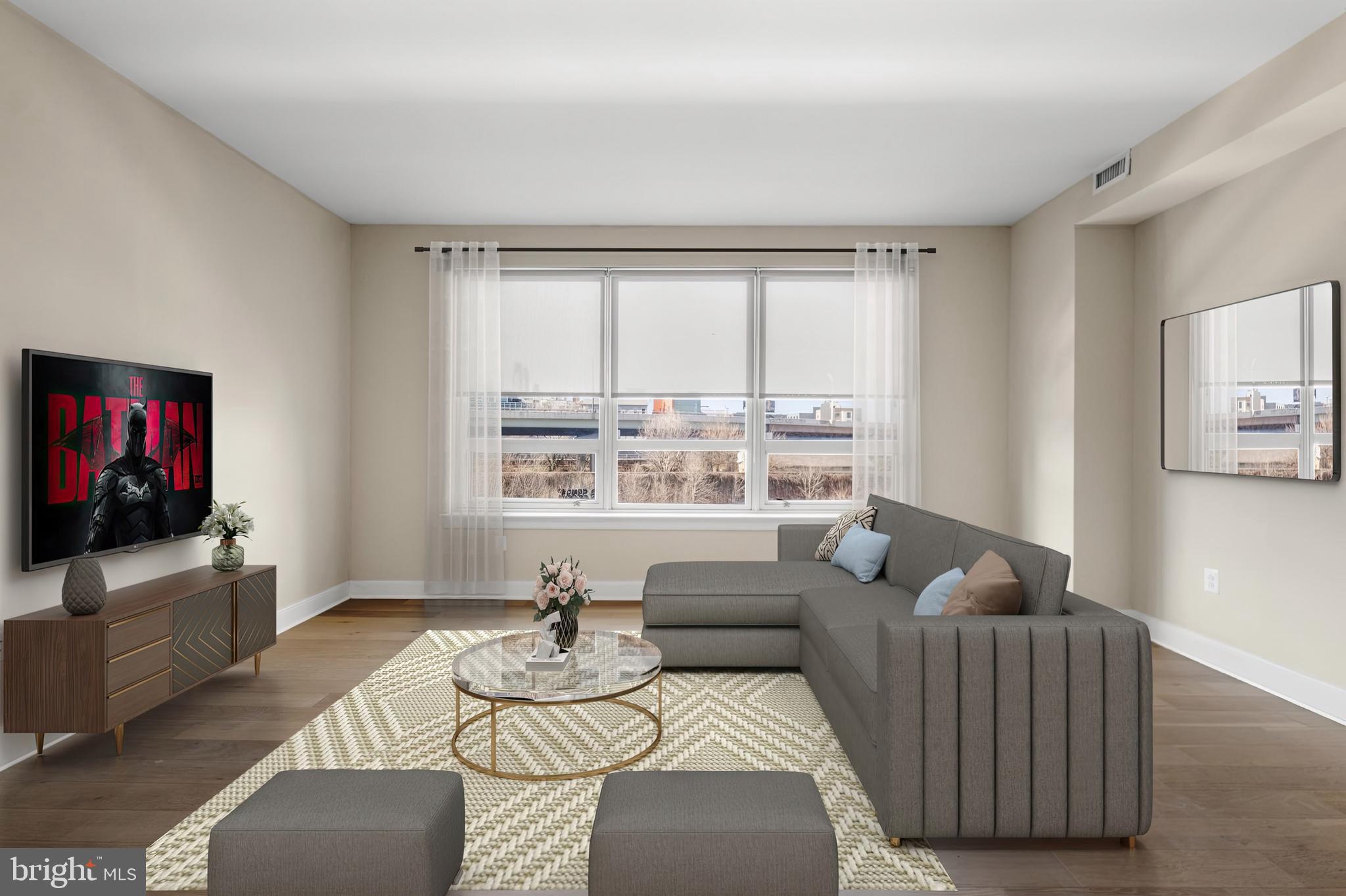 235 North Christopher Columbus Boulevard, Unit 1110 Philadelphia, PA 19106 - Photo 24 of 55 a living room with furniture and a flat screen tv