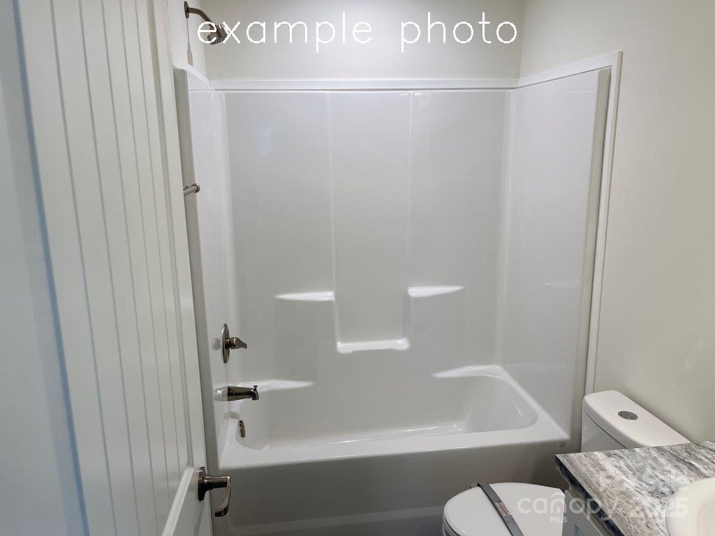 106 Lane Street, Unit 6 Morganton, NC 28655 - Photo 18 of 19 a bathroom with a shower and a toilet