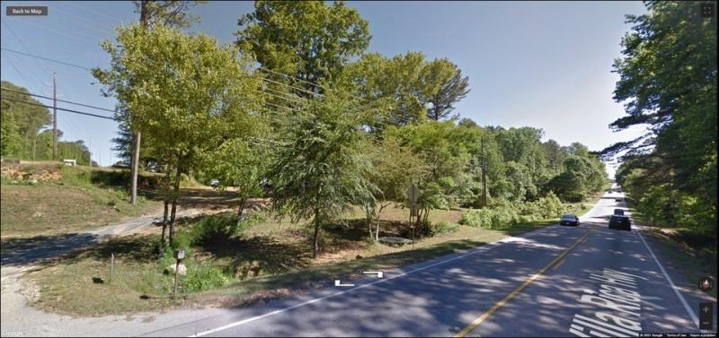 283 Villa Rica Highway Dallas, GA 30157 - Photo 4 of 4 a backyard of a house with a yard and outdoor seating