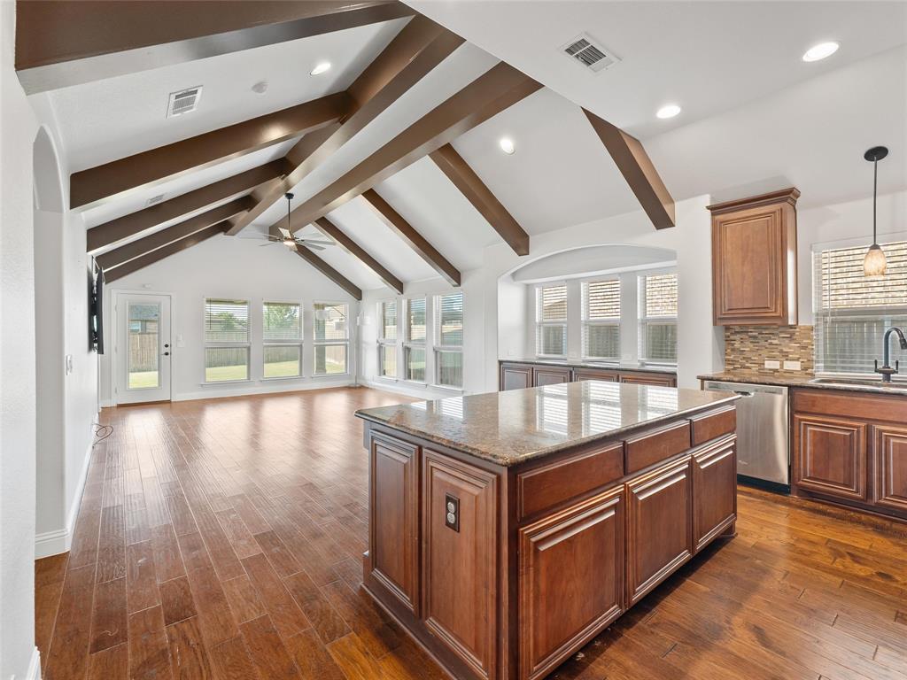 218 Calvert Drive Midlothian, TX 76065 - Photo 3 of 27 a kitchen with stainless steel appliances granite countertop a stove and a large window