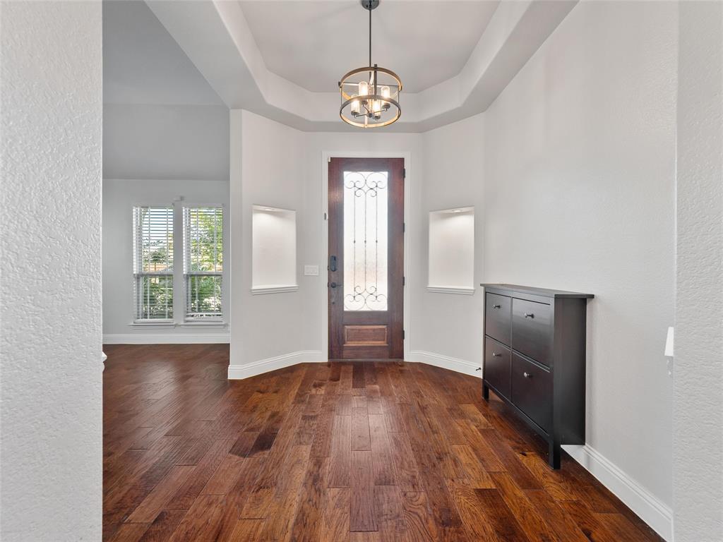 218 Calvert Drive Midlothian, TX 76065 - Photo 4 of 27 a view of livingroom with hardwood floor and window