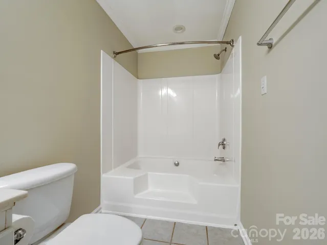 a bathroom with a toilet and a bathtub