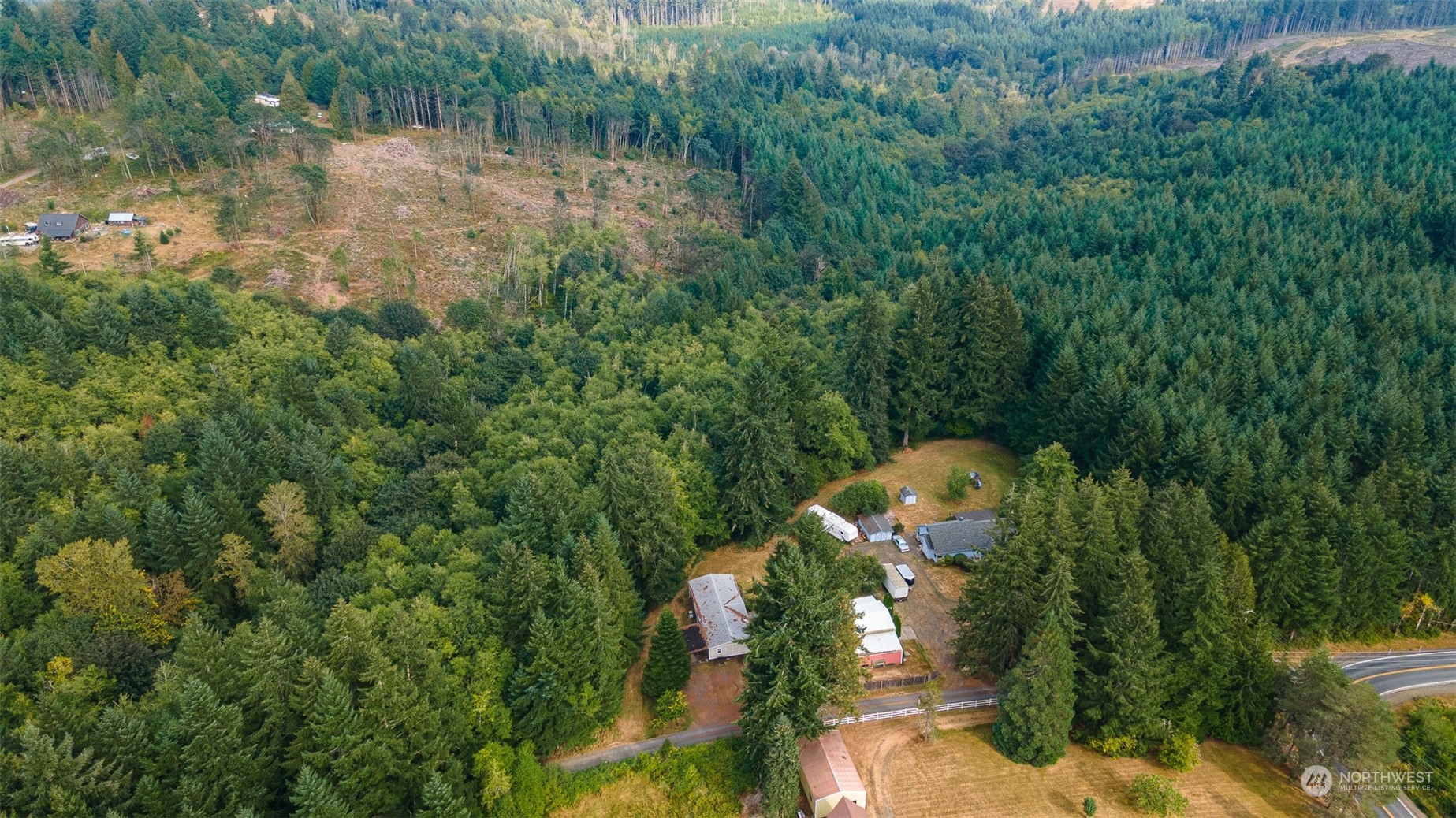 504 Brockway Road Chehalis, WA 98532 - Photo 36 of 40 a aerial view of a house with a yard and large trees