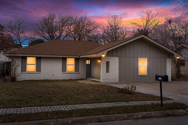 a front view of a house with yard