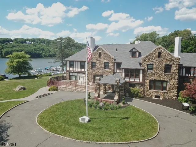 a view of a house with a backyard porch and sitting area