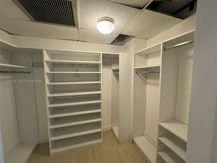 a view of a swimming pool with outdoor seating