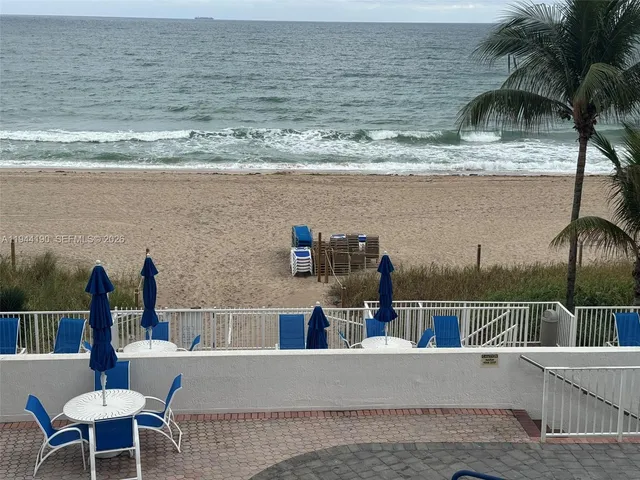 a kitchen that has a sink a stove top oven a refrigerator and a sink