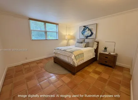 a spacious bedroom with a bed and window