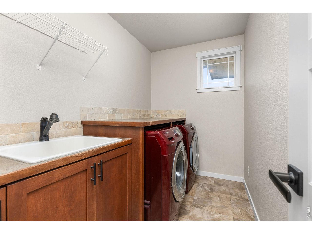 2905 68th Avenue Greeley, CO 80634 - Photo 22 of 40 Upstairs laundry room with sink. Washer and dryer included.