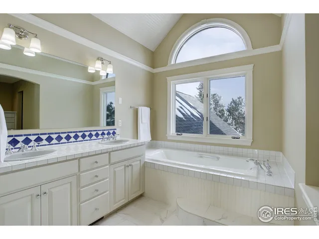 a bathroom with a sink a vanity and a mirror