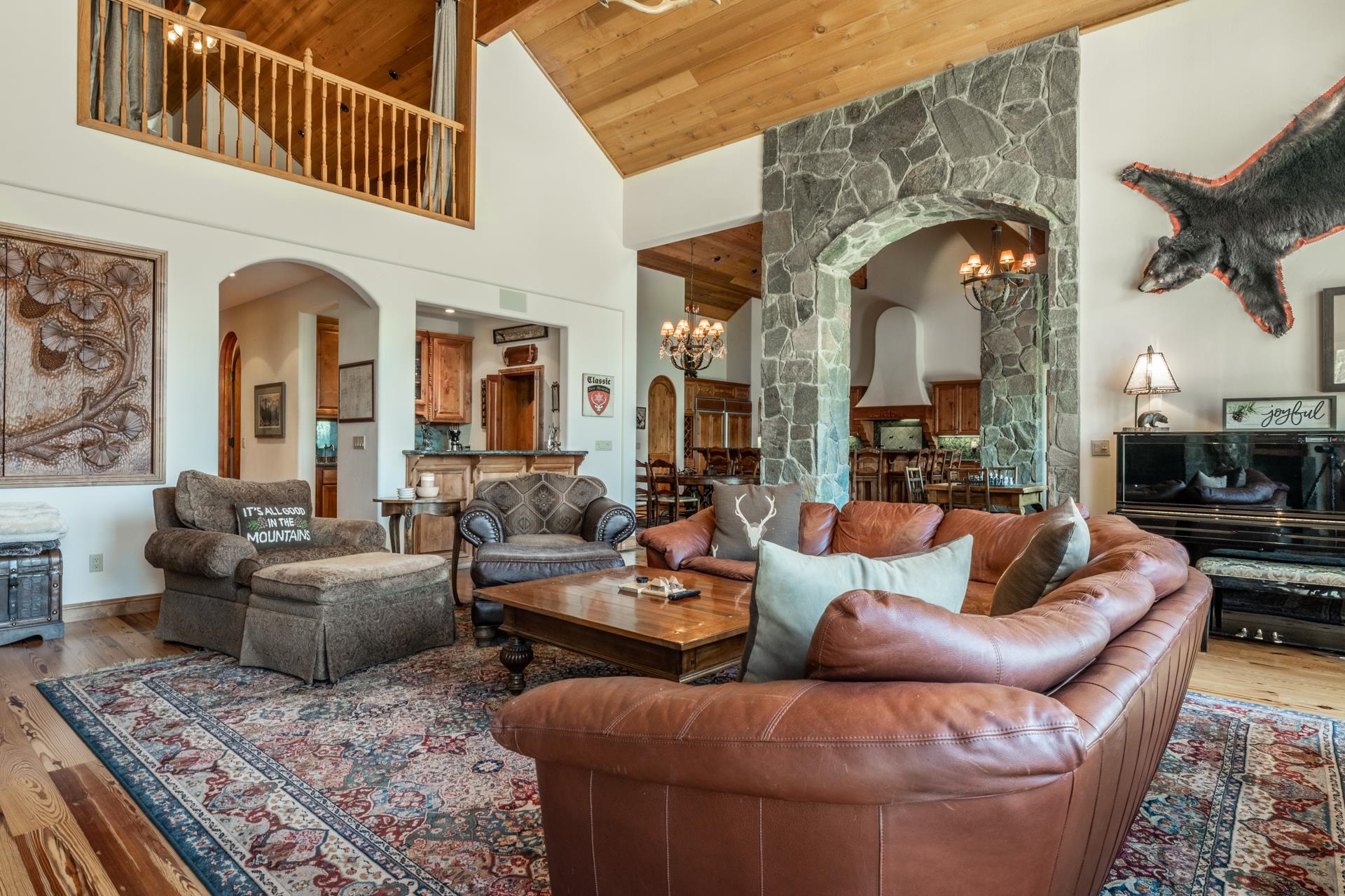 45 Skyline Road June Lake, CA 93529 - Photo 5 of 58 a living room with fireplace furniture and a rug