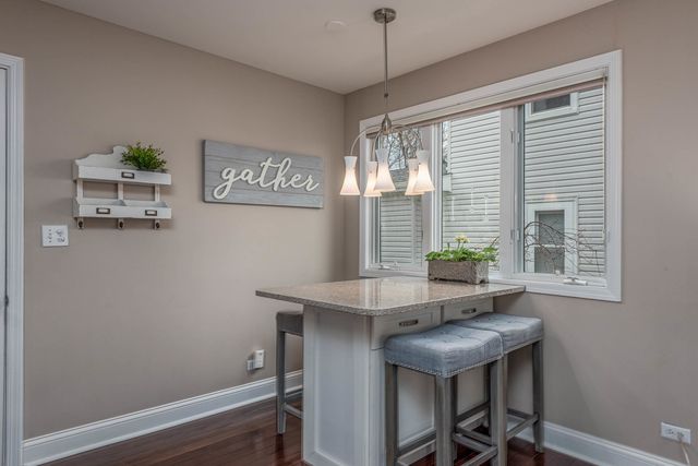 a view of a room with furniture and window