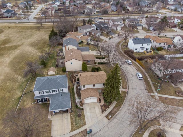 an aerial view of residential houses with outdoor space