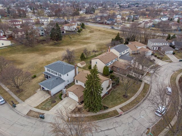 an aerial view of a house with outdoor space