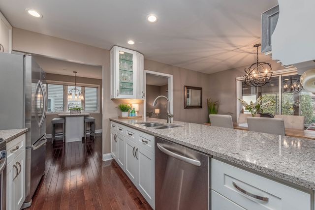 a kitchen with lots of counter space and wooden floor