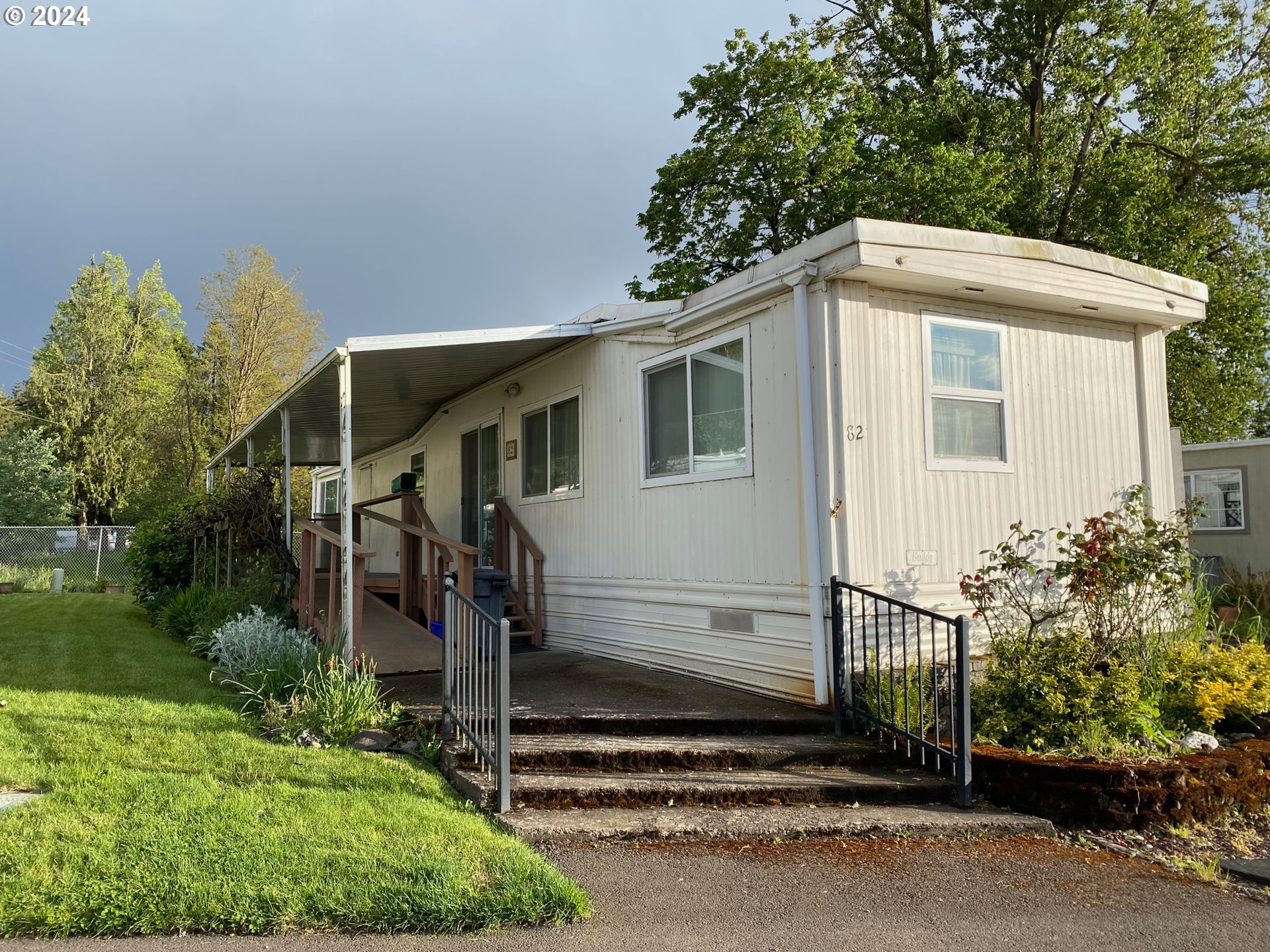 a side view of a house with a yard
