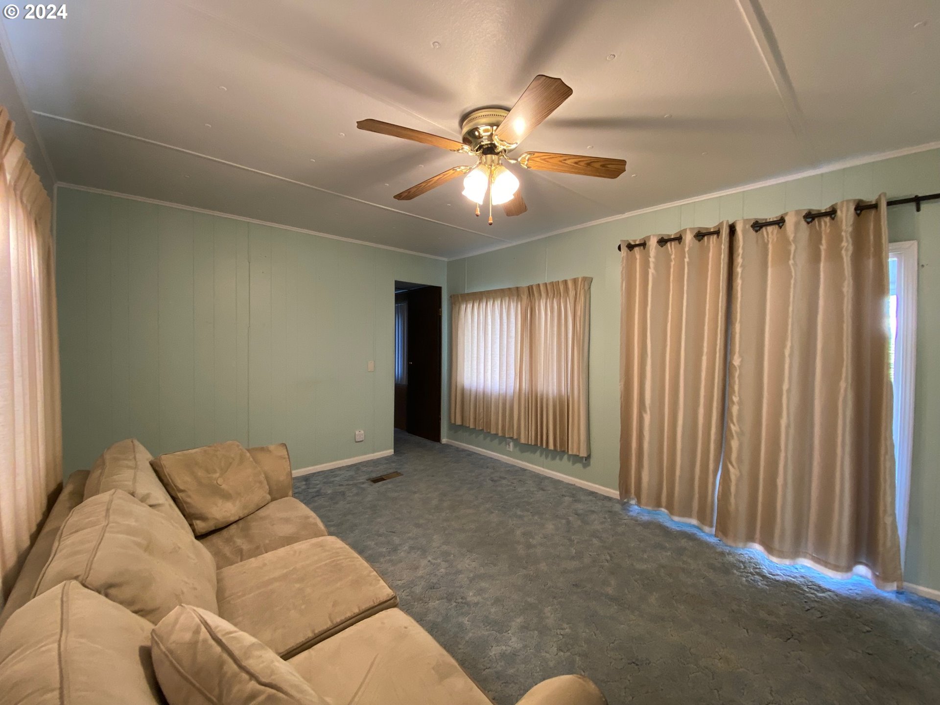 3950 Coburg Road, Unit 82 Eugene, OR 97408 - Photo 14 of 22 a living room with furniture and window