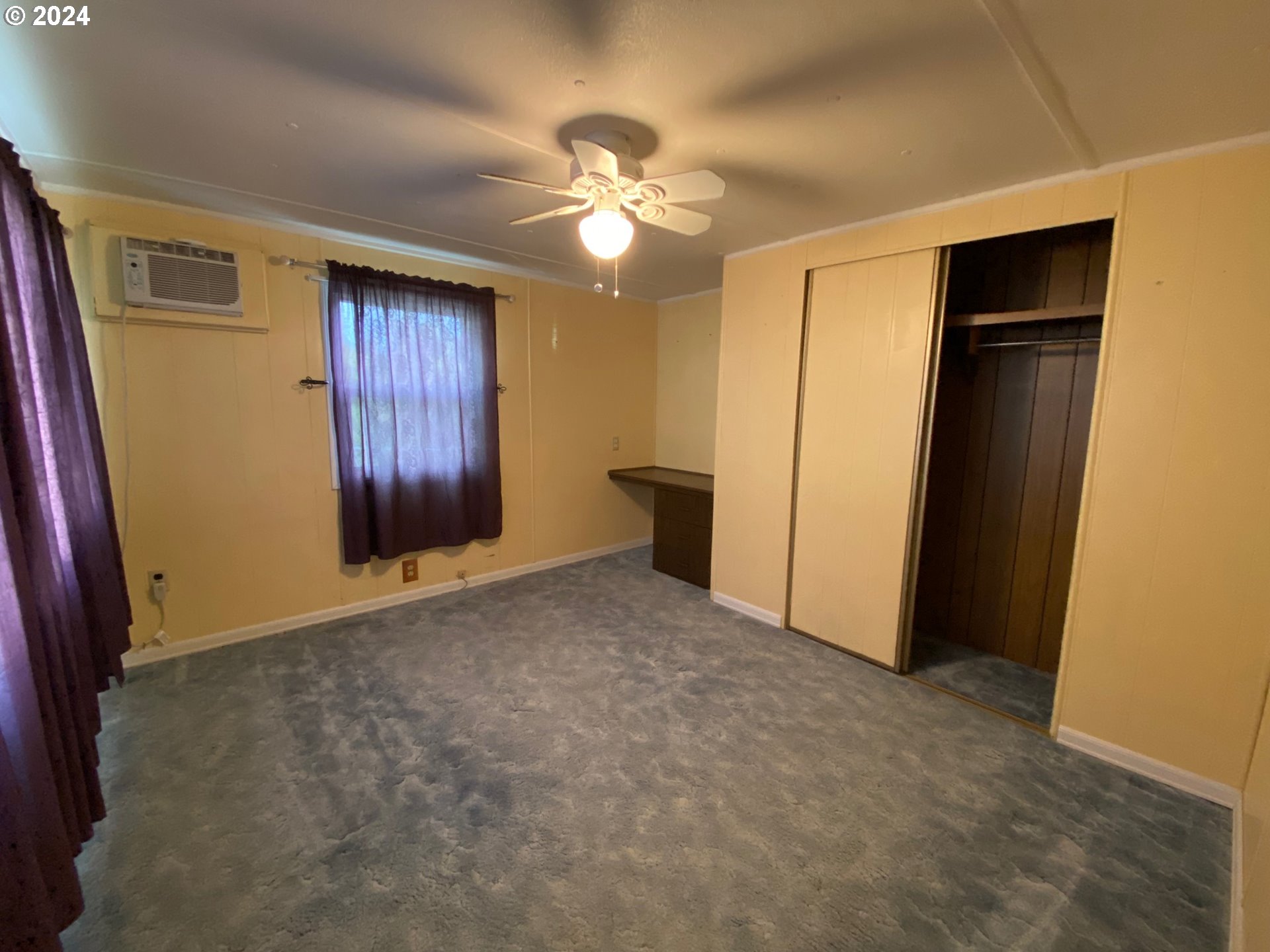 3950 Coburg Road, Unit 82 Eugene, OR 97408 - Photo 17 of 22 a view of empty room with a ceiling fan
