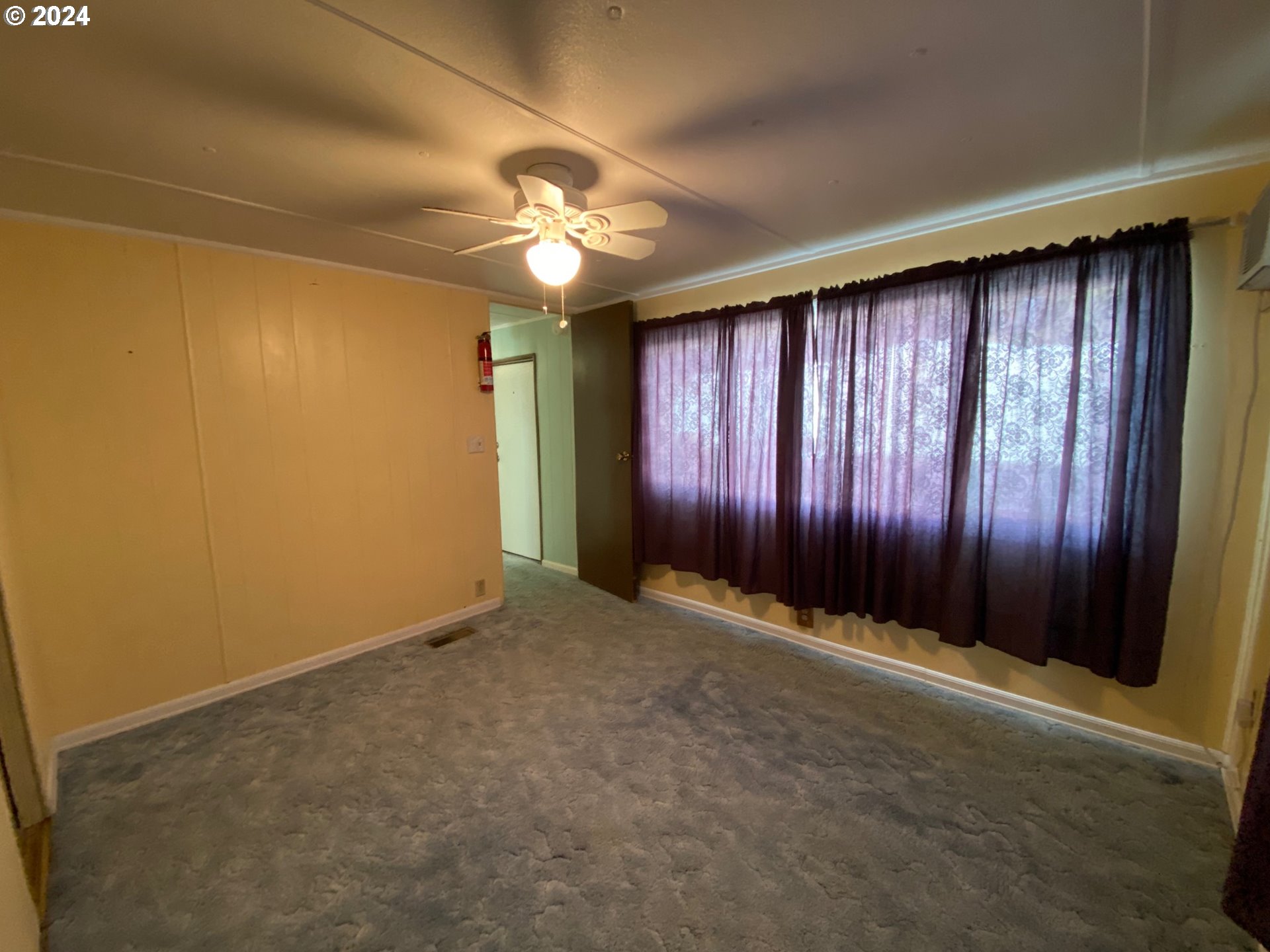 3950 Coburg Road, Unit 82 Eugene, OR 97408 - Photo 18 of 22 an empty room with a window and a projector