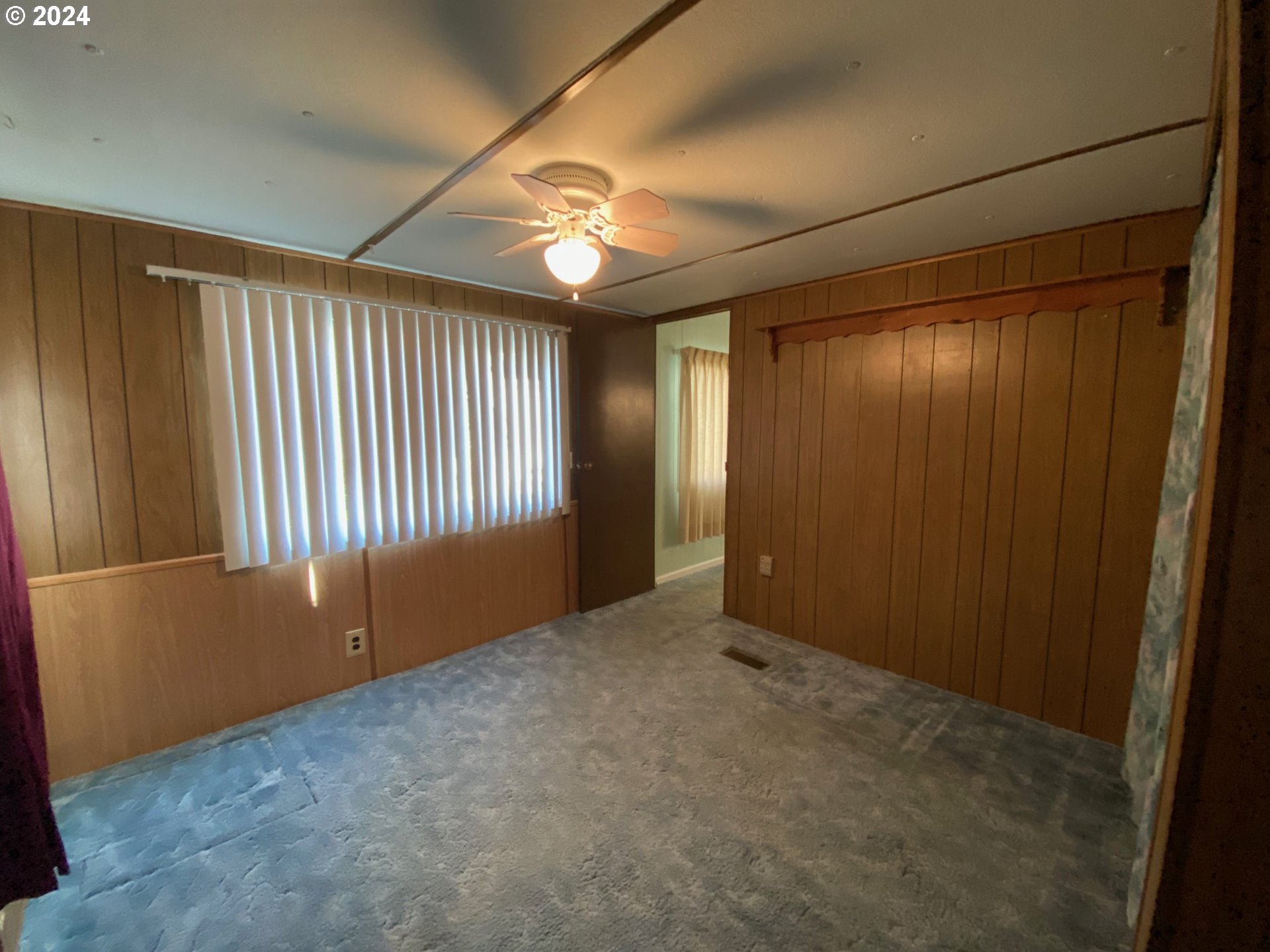 3950 Coburg Road, Unit 82 Eugene, OR 97408 - Photo 20 of 22 a view of an empty room with a window