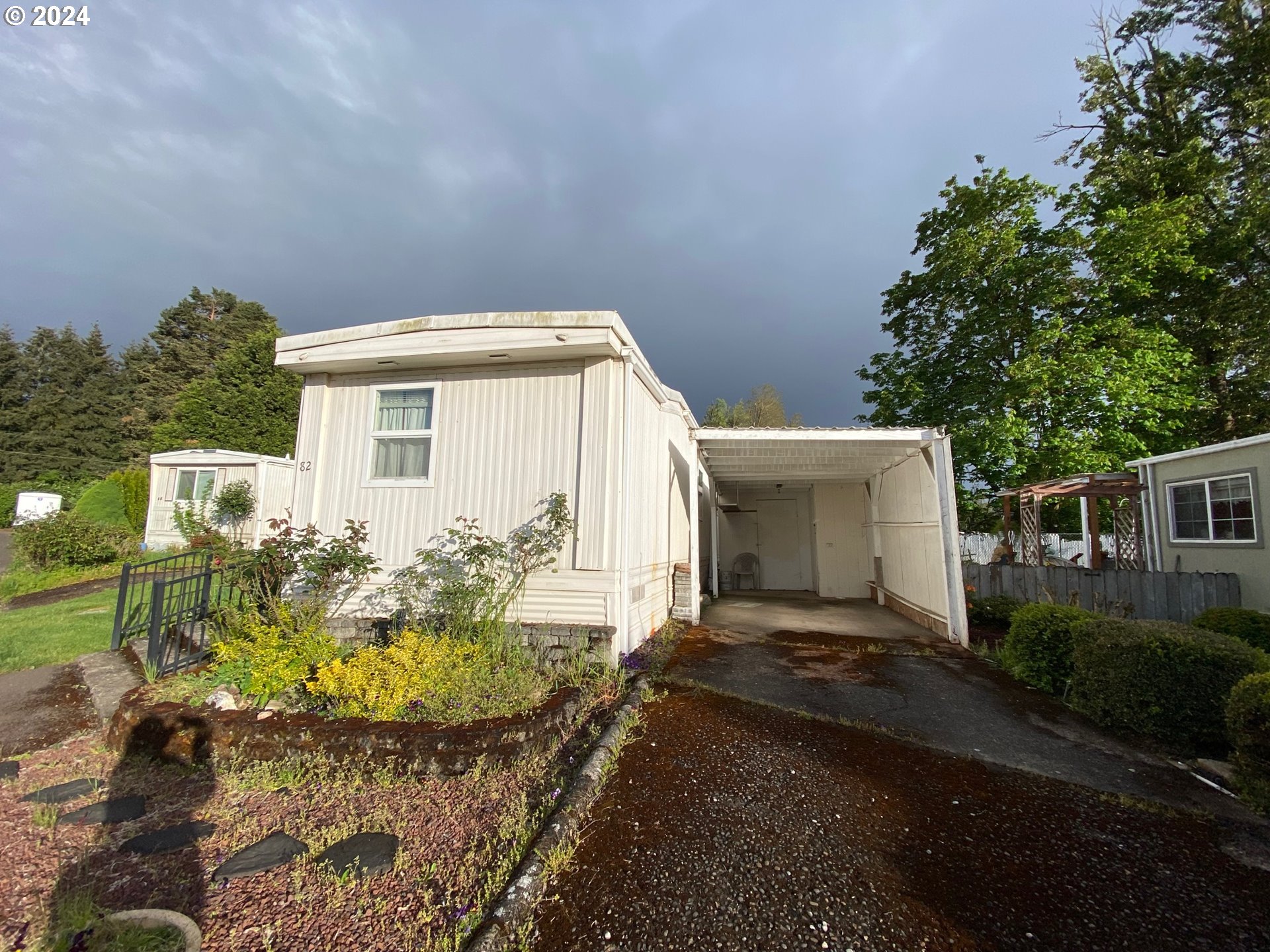 3950 Coburg Road, Unit 82 Eugene, OR 97408 - Photo 2 of 22 a view of a house with backyard and garden