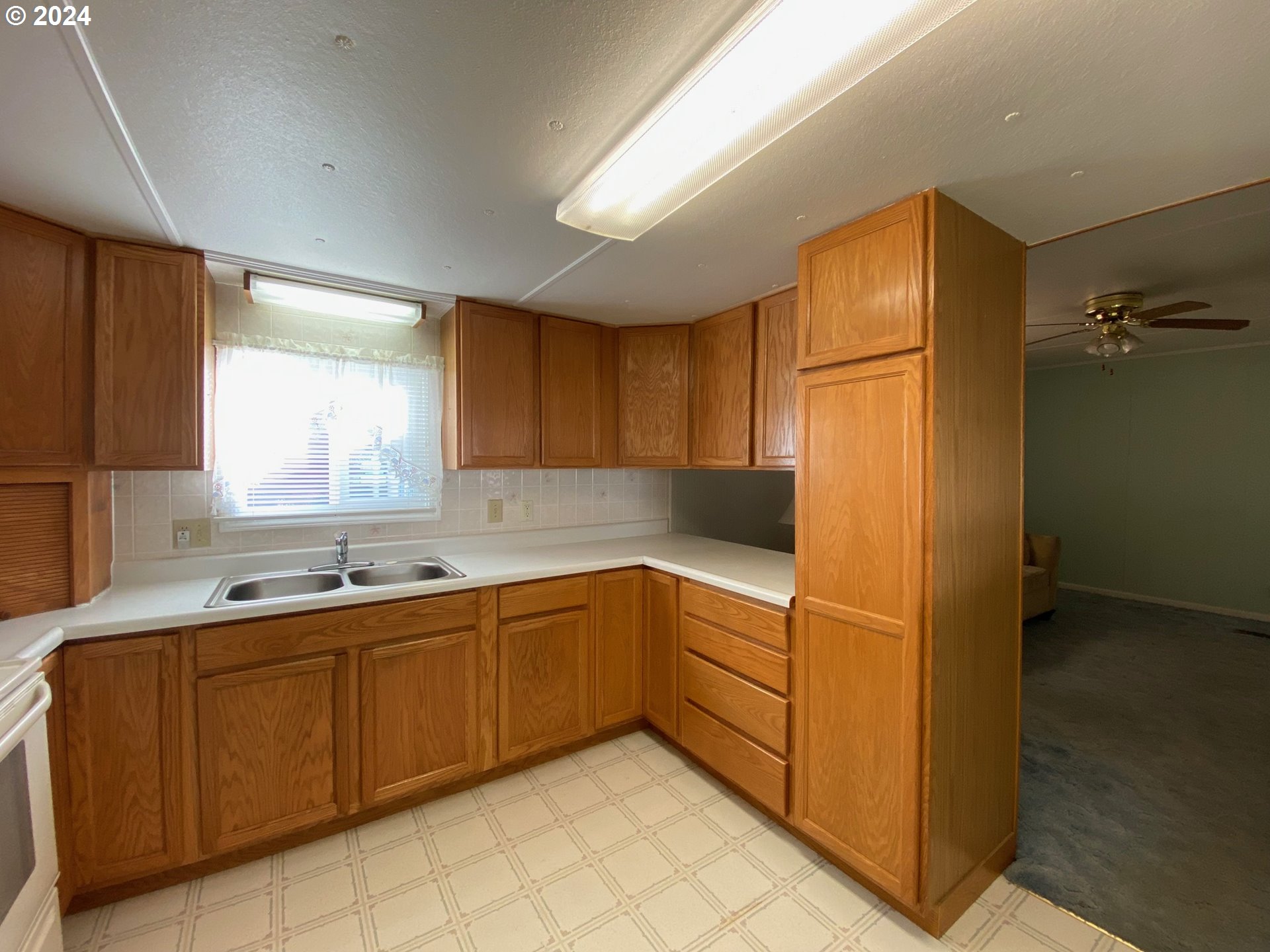 3950 Coburg Road, Unit 82 Eugene, OR 97408 - Photo 9 of 22 a kitchen with a sink and cabinets