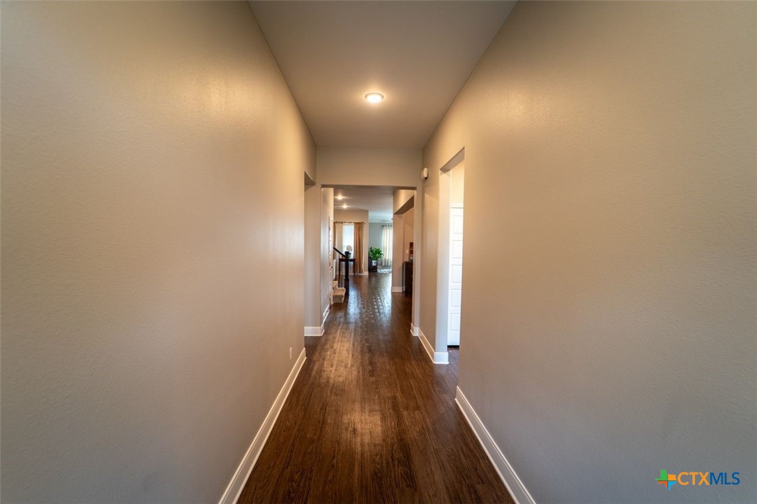 113 Terra Vista Ranch Road Victoria, TX 77904 - Photo 24 of 27 a view of a hallway with wooden floor