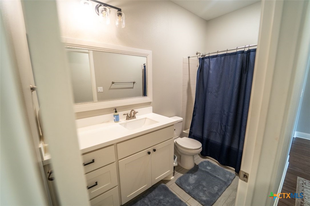 113 Terra Vista Ranch Road Victoria, TX 77904 - Photo 25 of 27 a bathroom with a sink toilet and shower