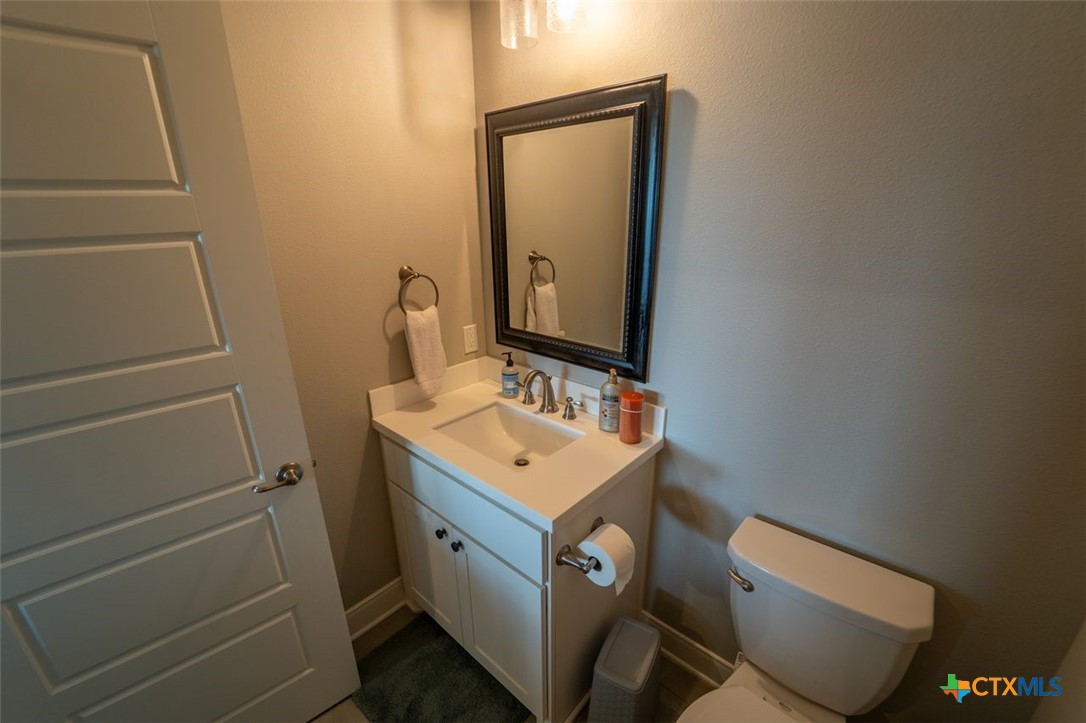 113 Terra Vista Ranch Road Victoria, TX 77904 - Photo 26 of 27 a bathroom with a sink a toilet and mirror