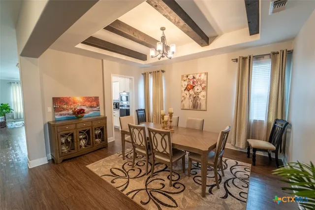 a view of a livingroom with furniture and a flat screen tv