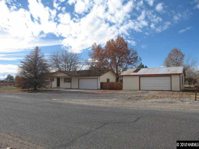 1517 Red Road Fallon, NV 89406 - Photo 1 of 13 a front view of a house with a yard and garage