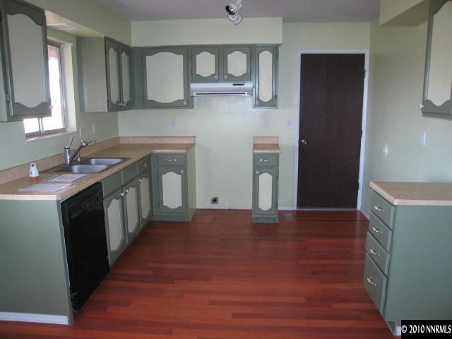 1517 Red Road Fallon, NV 89406 - Photo 5 of 13 a kitchen with stainless steel appliances granite countertop a sink stove and refrigerator