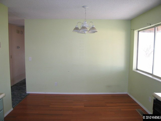 1517 Red Road Fallon, NV 89406 - Photo 6 of 13 a view of a room with wooden floor and fan