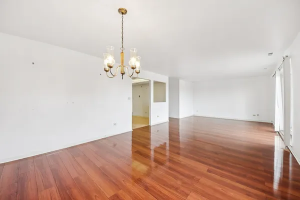 a kitchen that has a sink cabinets stainless steel appliances and a window