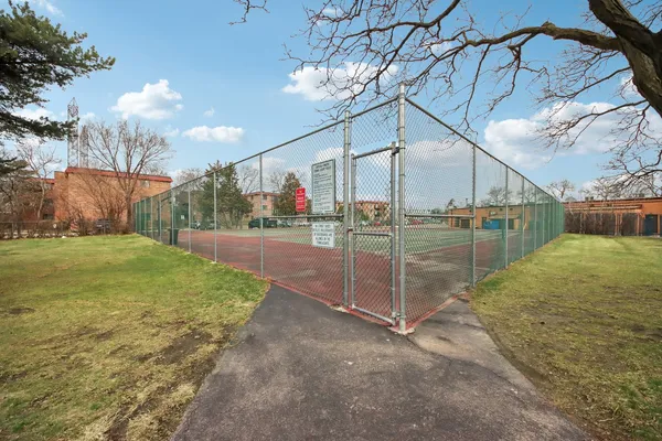 a view of a street with a building in the background