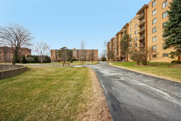 a swimming pool with outdoor seating and yard