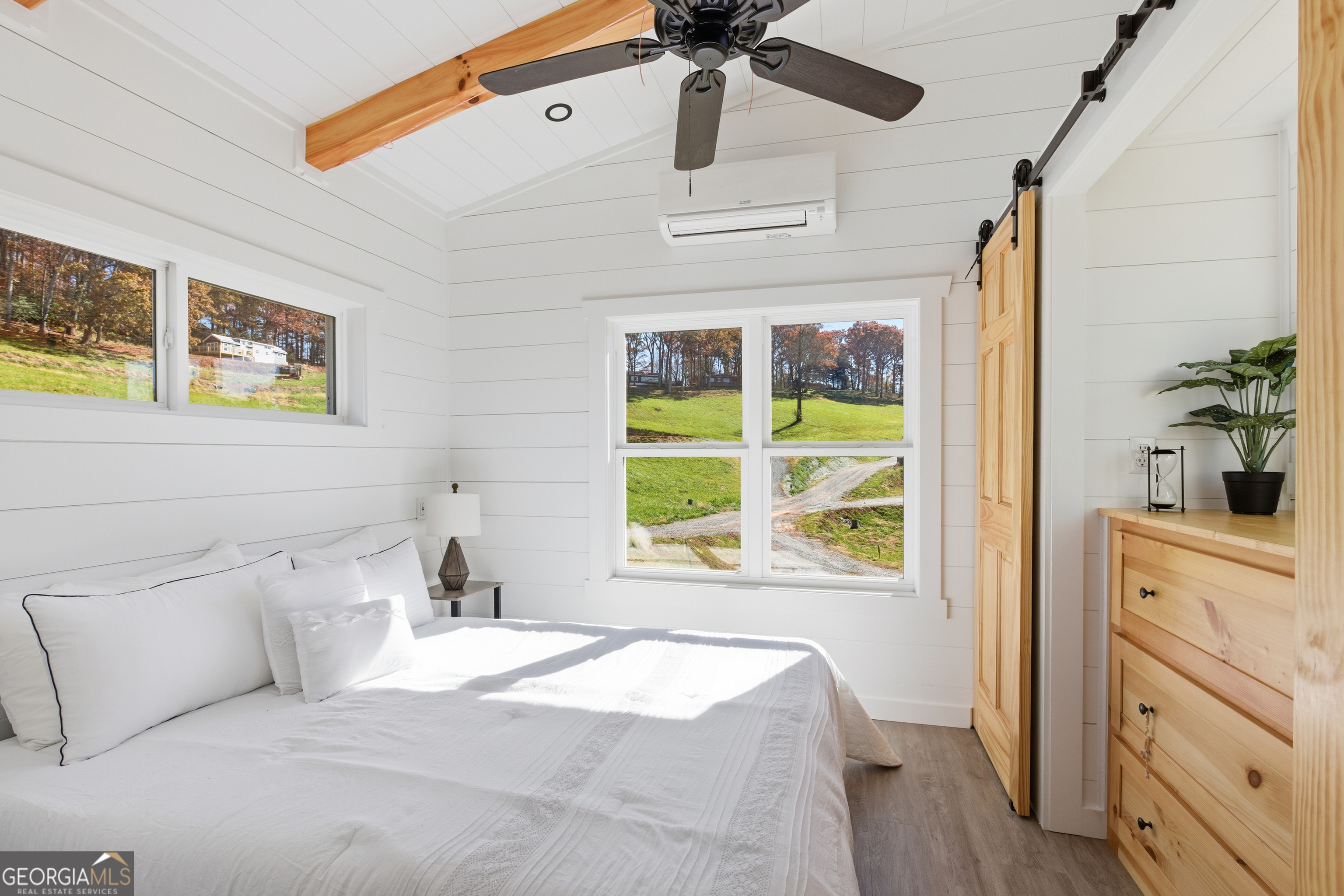 527 Saunders Road Franklin, NC 28734 - Photo 17 of 22 a bedroom with a bed and a window