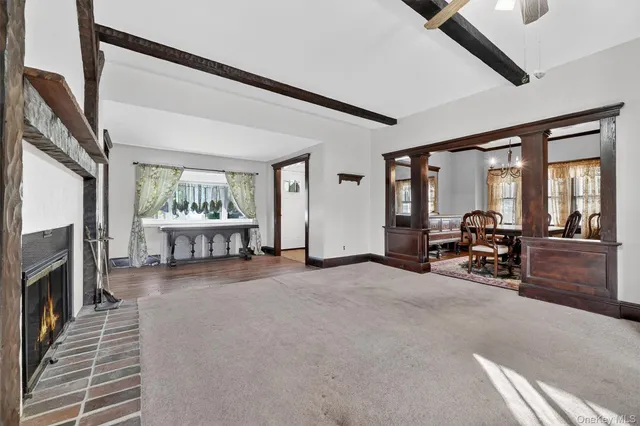 a view of a livingroom with furniture and a fireplace