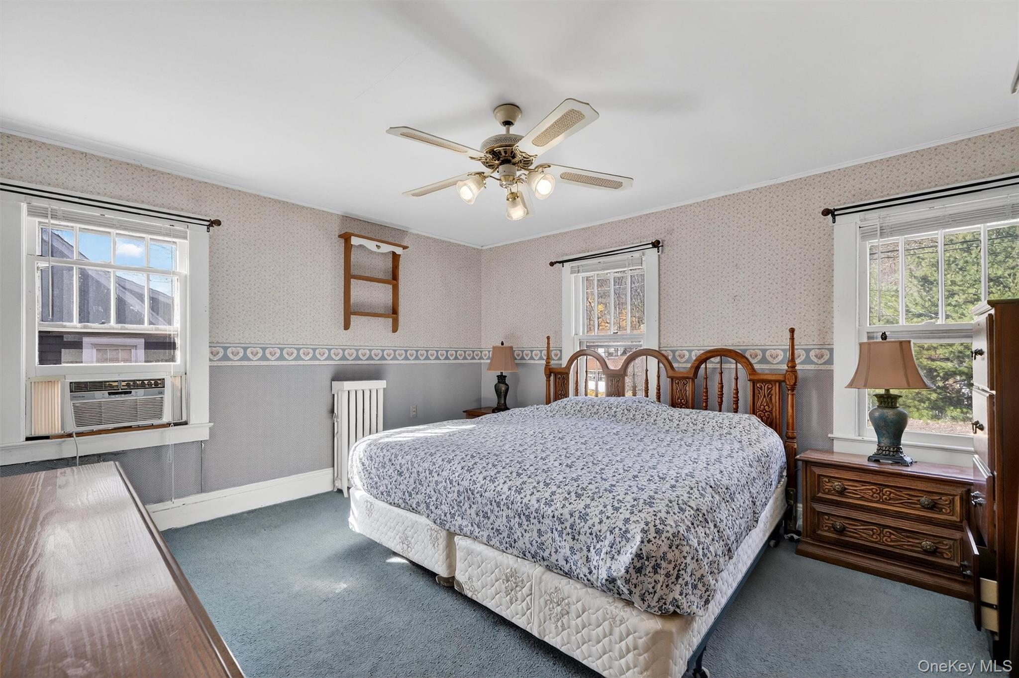 165 Wayne Avenue Suffern, NY 10901 - Photo 25 of 38 Bedroom featuring carpet flooring, radiator, ceiling fan, and wallpapered walls