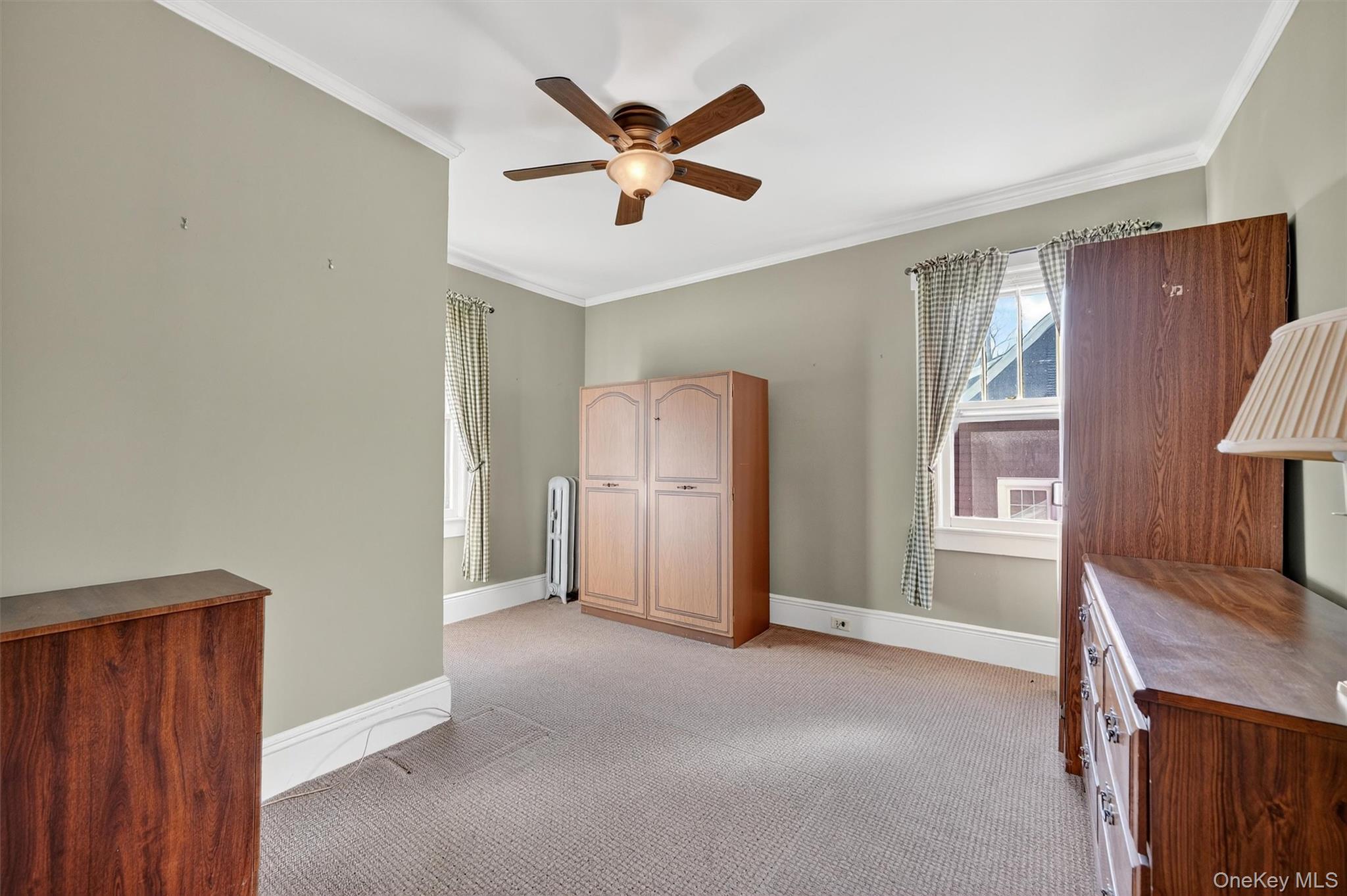 165 Wayne Avenue Suffern, NY 10901 - Photo 27 of 38 Unfurnished bedroom featuring crown molding, light carpet, and ceiling fan