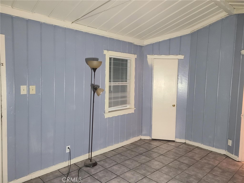 14301 Frontage Road, Unit 3 North Edwards, CA 93523 - Photo 10 of 13 a view of an empty room with window and chandelier fan