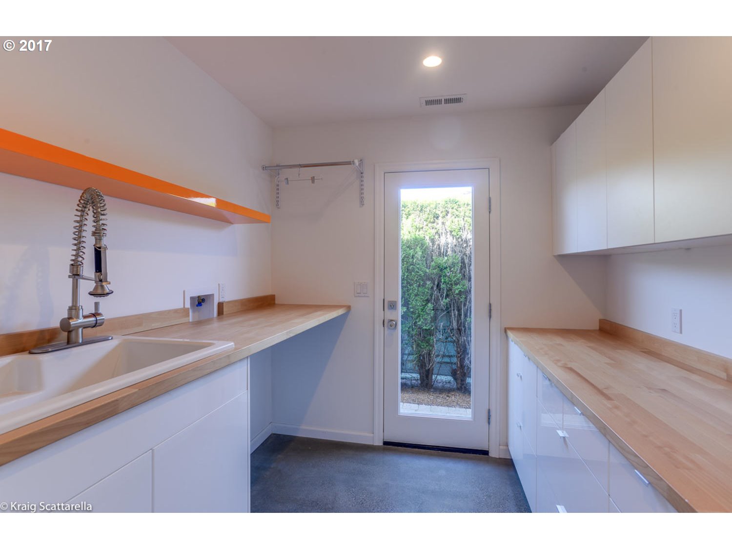8220 Southwest 3rd Avenue Portland, OR 97219 - Photo 21 of 32 a kitchen view with a sink a counter space and wooden floor
