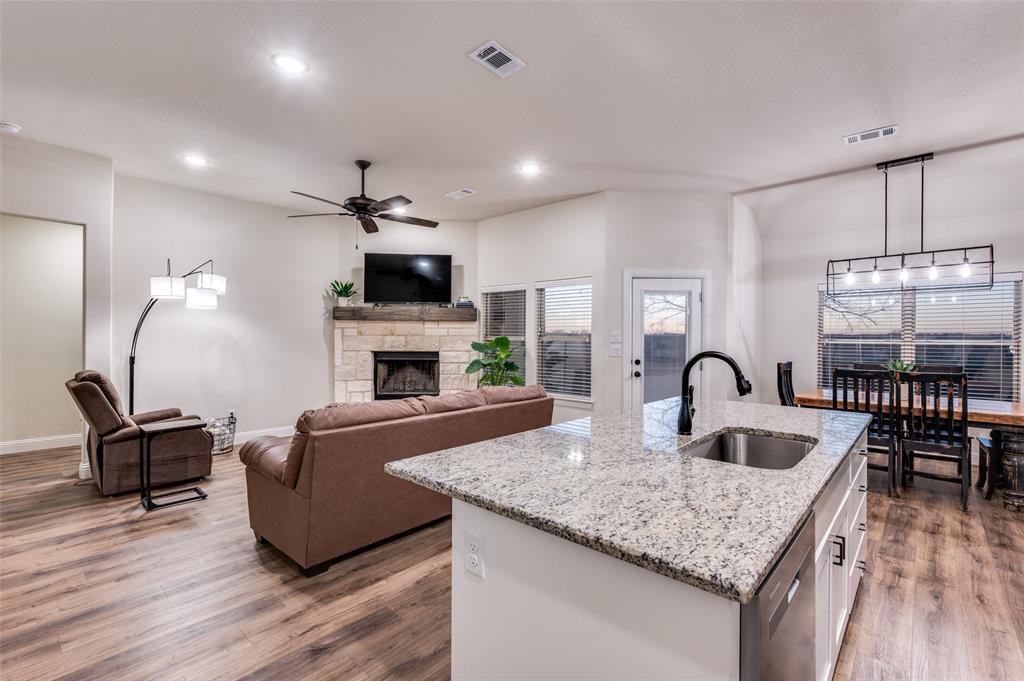 331 Osage Court Krum, TX 76249 - Photo 8 of 19 Granite island with farmhouse sink