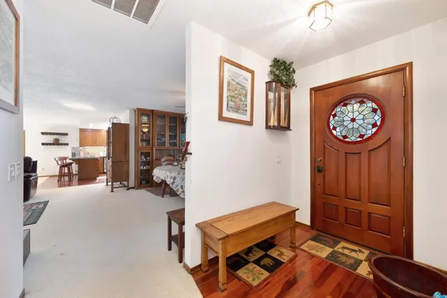 a living room with furniture and flat screen tv