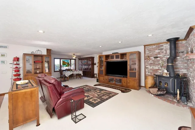 a view of a livingroom with furniture and a flat screen tv